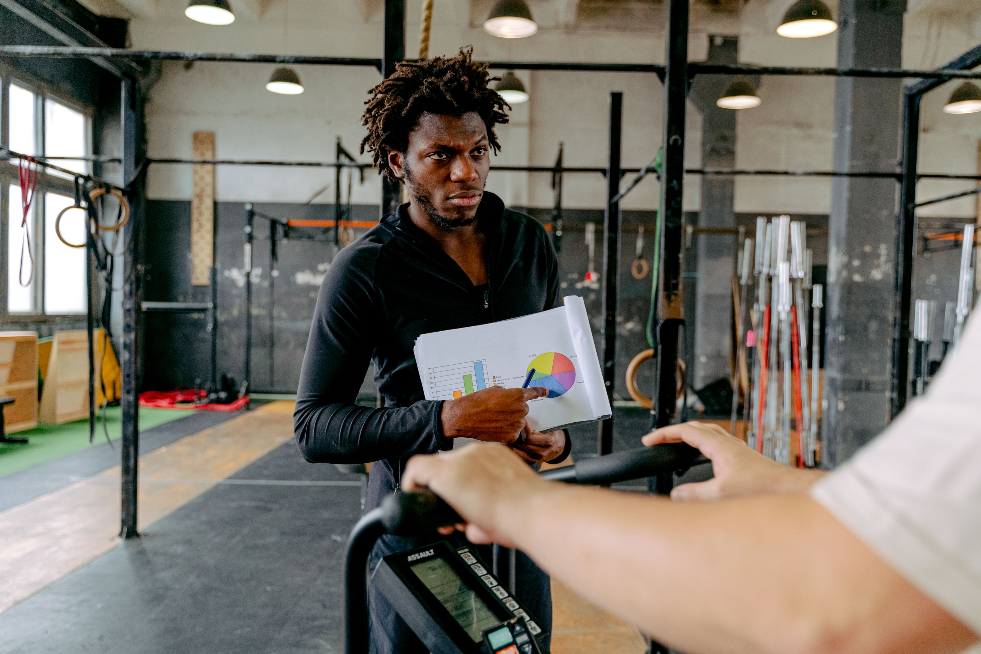 A personal trainer coaching a client through a workout